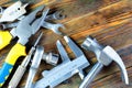 Building tools on wooden background, holiday, fathers day. Popular locksmith tools for creativity and business - the hammer of the