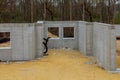 Building under construction in the cement foundation of a new housing development Royalty Free Stock Photo