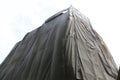 Building under construction with covered by black canvas Royalty Free Stock Photo
