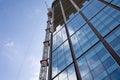 Building under construction and cranes under a cloudy sky Royalty Free Stock Photo