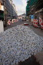 Street constructions, paving stones are piled up in front of an area prohibited to the public Royalty Free Stock Photo
