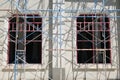 Building under construction with scaffold in front Royalty Free Stock Photo