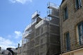 Building under construction in Vannes city with scaffolding Royalty Free Stock Photo