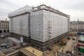 Building under refurbishment with construction plastic covering Royalty Free Stock Photo