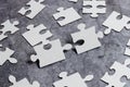Close-Up White Jigsaw Pattern Puzzle Pieces To Be Connected With Missing Last Piece Positioned On A Flat Lay Background With Royalty Free Stock Photo
