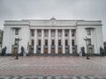 The building of the Verkhovna Rada of Ukraine, on a cloudy day, the facade of the main entrance.