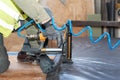 Building a wall for frame house. Worker use autofeed staple gun for attaching a vapor barrier. Royalty Free Stock Photo