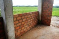 Building the walls of the house with red bricks. Royalty Free Stock Photo