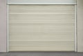 Building with white roller shutter garage door Royalty Free Stock Photo