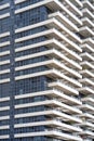 Building window and balconies in the building. Modern apartment buildings in new neighborhood. Texture Royalty Free Stock Photo