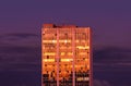 Building with windows in golden color at sunset Royalty Free Stock Photo