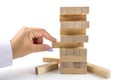 Building from wooden blocks. Wood blocks stack game with Hand on background. Conceptual of Teamwork Royalty Free Stock Photo