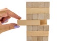 Building from wooden blocks. Wood blocks stack game with Hand on background. Conceptual of Teamwork Royalty Free Stock Photo