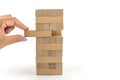 Building from wooden blocks. Wood blocks stack game with Hand on background. Conceptual of Teamwork Royalty Free Stock Photo