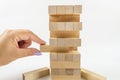 Building from wooden blocks. Wood blocks stack game with Hand on background. Conceptual of Teamwork Royalty Free Stock Photo