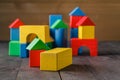 Building from wooden colourful childrens blocks Royalty Free Stock Photo