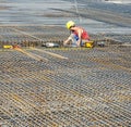 Building worker lays reinforcement