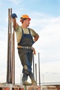 Building workerat pouring concrete