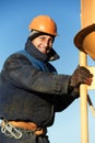 Building workers pouring concrete with barrel