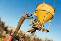 Building workers pouring concrete with barrel Royalty Free Stock Photo