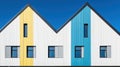 A building with a yellow and blue stripe. Royalty Free Stock Photo