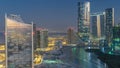 Buildings on Al Reem island in Abu Dhabi day to night from above. Royalty Free Stock Photo