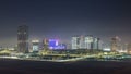 Buildings on Al Reem island in Abu Dhabi night timelapse from above. Royalty Free Stock Photo