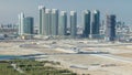 Buildings on Al Reem island in Abu Dhabi timelapse from above. Royalty Free Stock Photo