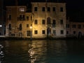 Buildings along the canal in Venice night, Italy