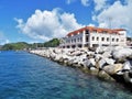 Buildings along the coastline of St. George harbor in the Caribbean island of Grenada Royalty Free Stock Photo