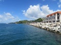 Buildings along the coastline of St. George harbor in the Caribbean island of Grenada Royalty Free Stock Photo