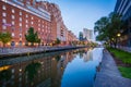 Buildings along the waterfront at twilight, in the Inner Harbor of Baltimore, Maryland Royalty Free Stock Photo