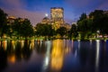 Buildings in Back Bay and the lake at the Public Garden at night Royalty Free Stock Photo