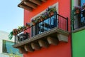 Buildings with beautiful windows, balconies and potted flowers Royalty Free Stock Photo