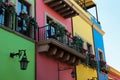 Buildings with beautiful windows, balconies and potted flowers Royalty Free Stock Photo