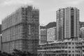 Buildings and a building under construction Royalty Free Stock Photo