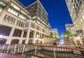 Buildings of Canary Wharf at night in London. View from the street Royalty Free Stock Photo