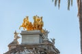 Buildings decorated with stucco and statues against the blue sky and white clouds. On the streets in Catalonia, public places