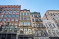 Buildings facades with fire escape stairs, sunny day Royalty Free Stock Photo