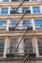 Buildings with fire escape stairs in Soho, NYC Royalty Free Stock Photo