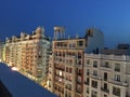 Buildings of the Gran Via illuminated at night.