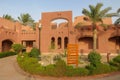 Buildings in a hotel complex in Egyptian style. Arabic architecture in Marsa Alam. Hotel rooms in buildings with ocher plaster. Royalty Free Stock Photo