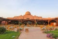 Buildings in a hotel complex in Egyptian style. Arabic architecture in Marsa Alam. Hotel rooms in buildings with ocher plaster. Royalty Free Stock Photo