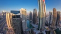 Buildings of Jumeirah Lakes Towers after sunset with traffic on the road day to night timelapse. Royalty Free Stock Photo