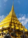 Golden Giants statue under golden pagoda in wat pra keaw , Bangkok , guarding statues of Golden Chedi at Wat Phra Kaew,golden Royalty Free Stock Photo