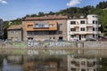 Buildings mirrored in the Somes River on August 21, 2018 in Cluj-Napoca