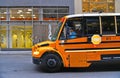 20.05.2016. buildings, modern architecture, yellow school bus with driver on the street in fifth avenue manhattan in new york Royalty Free Stock Photo