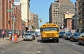 buildings, modern and old architecture, school bus and people on the streets in downtown manhattan in new york Royalty Free Stock Photo