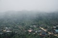 Buildings in mountain village. Foggy day, Top view village landscape Royalty Free Stock Photo