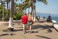 People walk along the Malecon in Puerto Vallarta